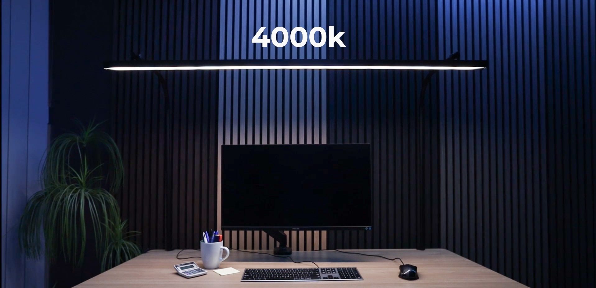 LightEFX Shift desk light set to 4000K neutral white colour temperature, producing balanced natural light over a desk with monitor and keyboard