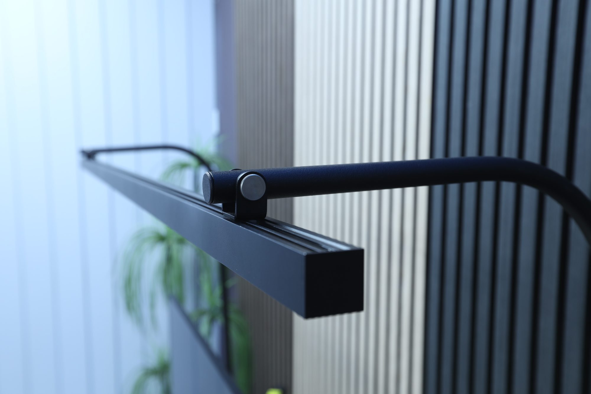 Close-up of the LightEFX Shift desk light 50 degree hinged adjustment mechanism showing the aluminium profile and pivot point